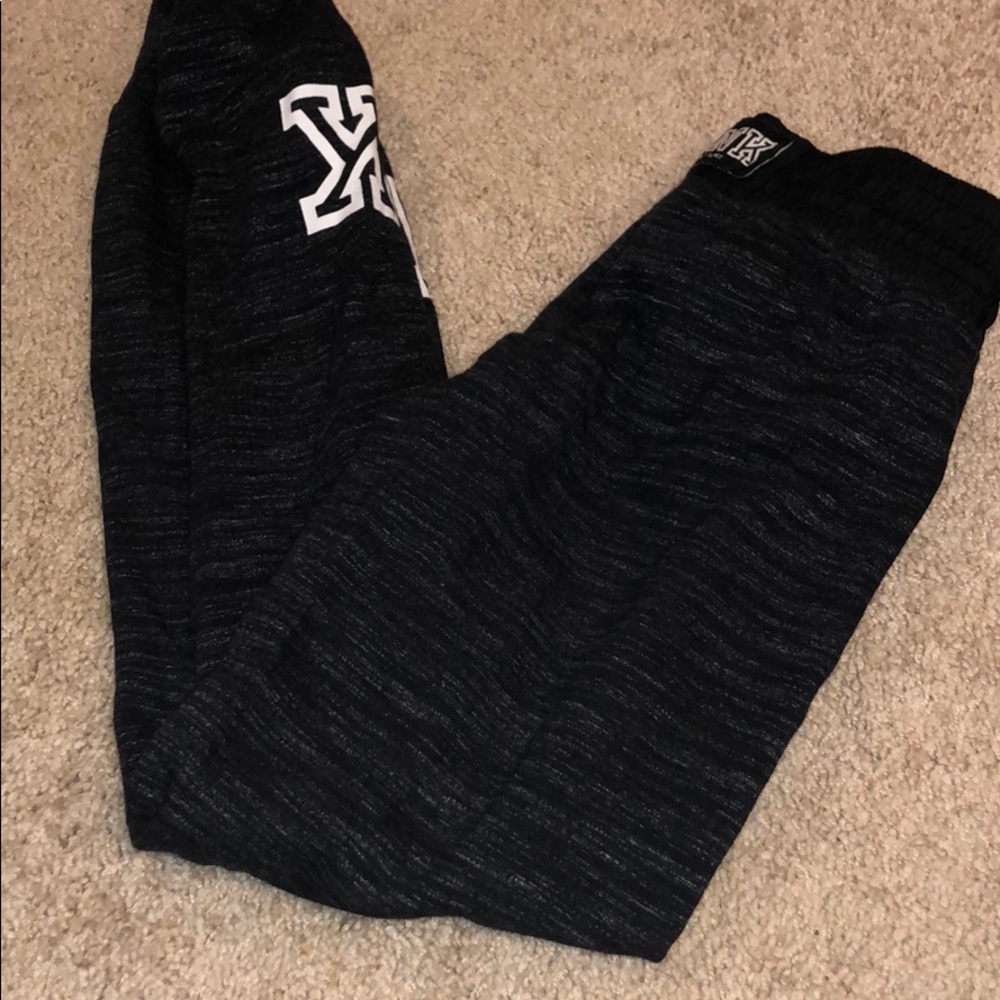 Pink joggers right bottoms w/ minor tear on seam